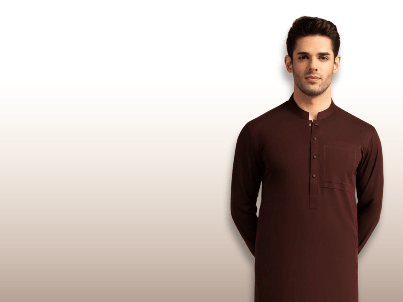 Man wearing a brown kurta against a white background