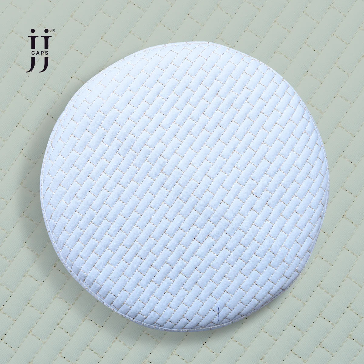 Cream side of the HayaStyle Kufi featuring the rich Faris design with mustard stitching.