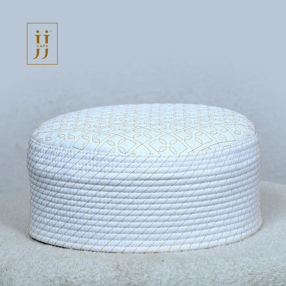 White side of the HayaStyle Kufi featuring the intricate Madinah pattern with golden embroidery.