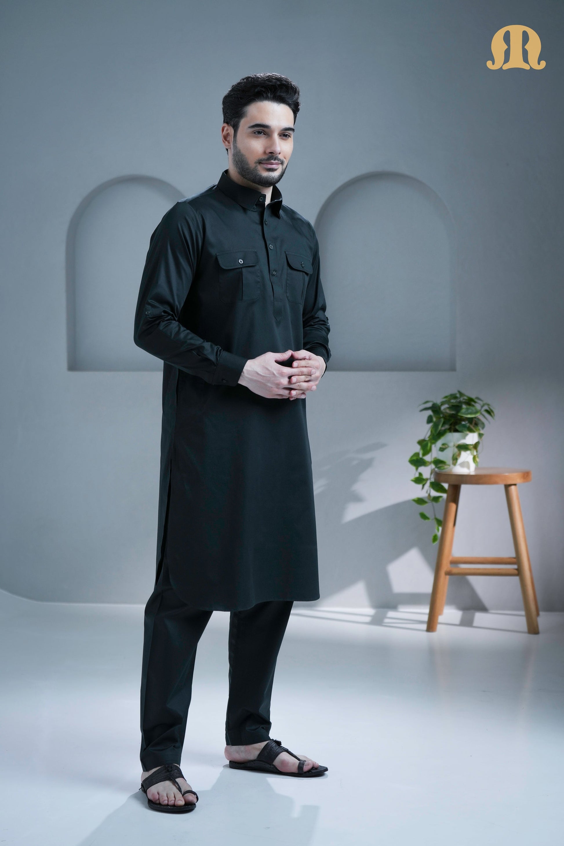 Close-up of the breathable cotton fabric and shirt collar on the dark grey Pathani kurta.