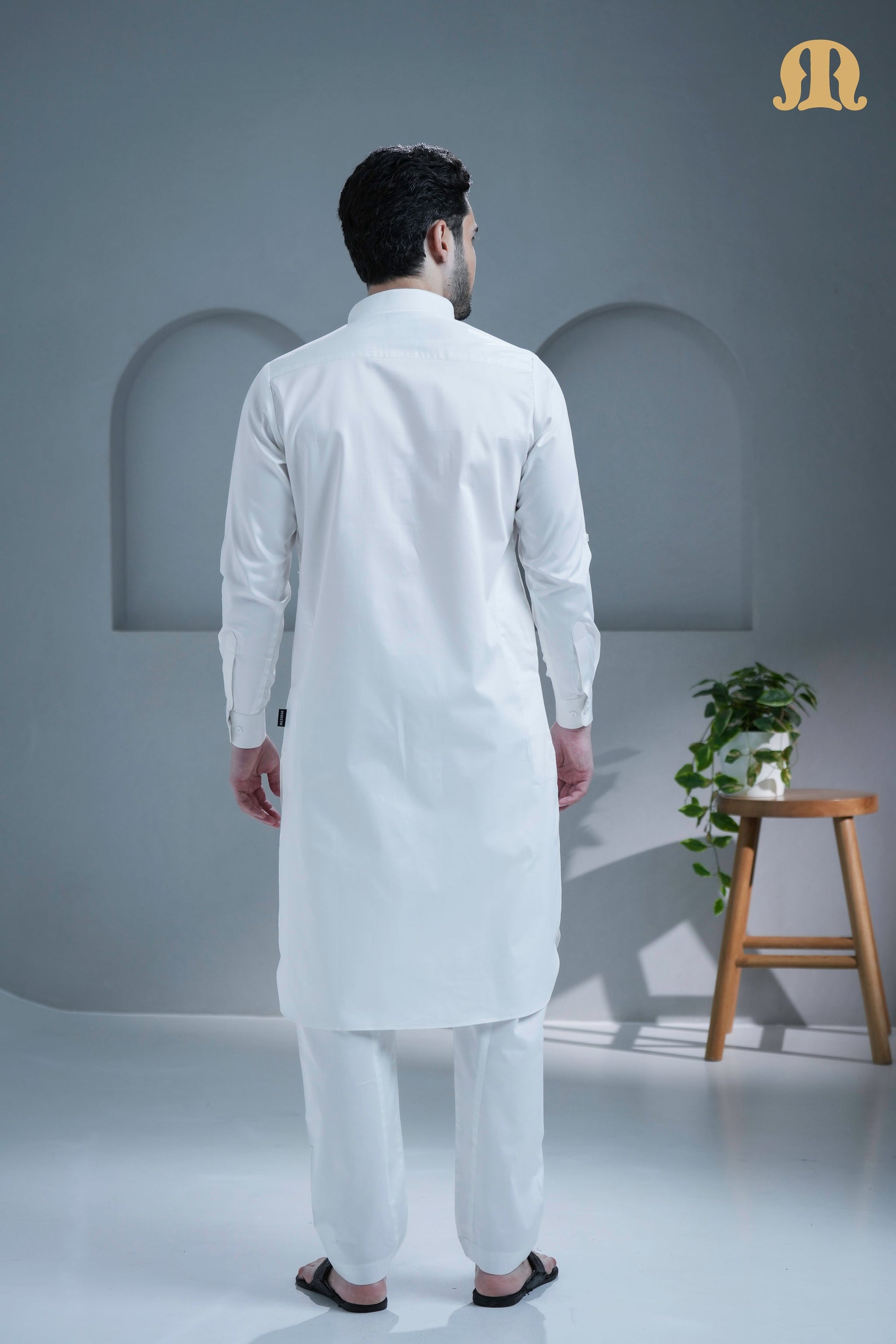 Side profile of the men's white cotton Pathani suit from Mashroo.