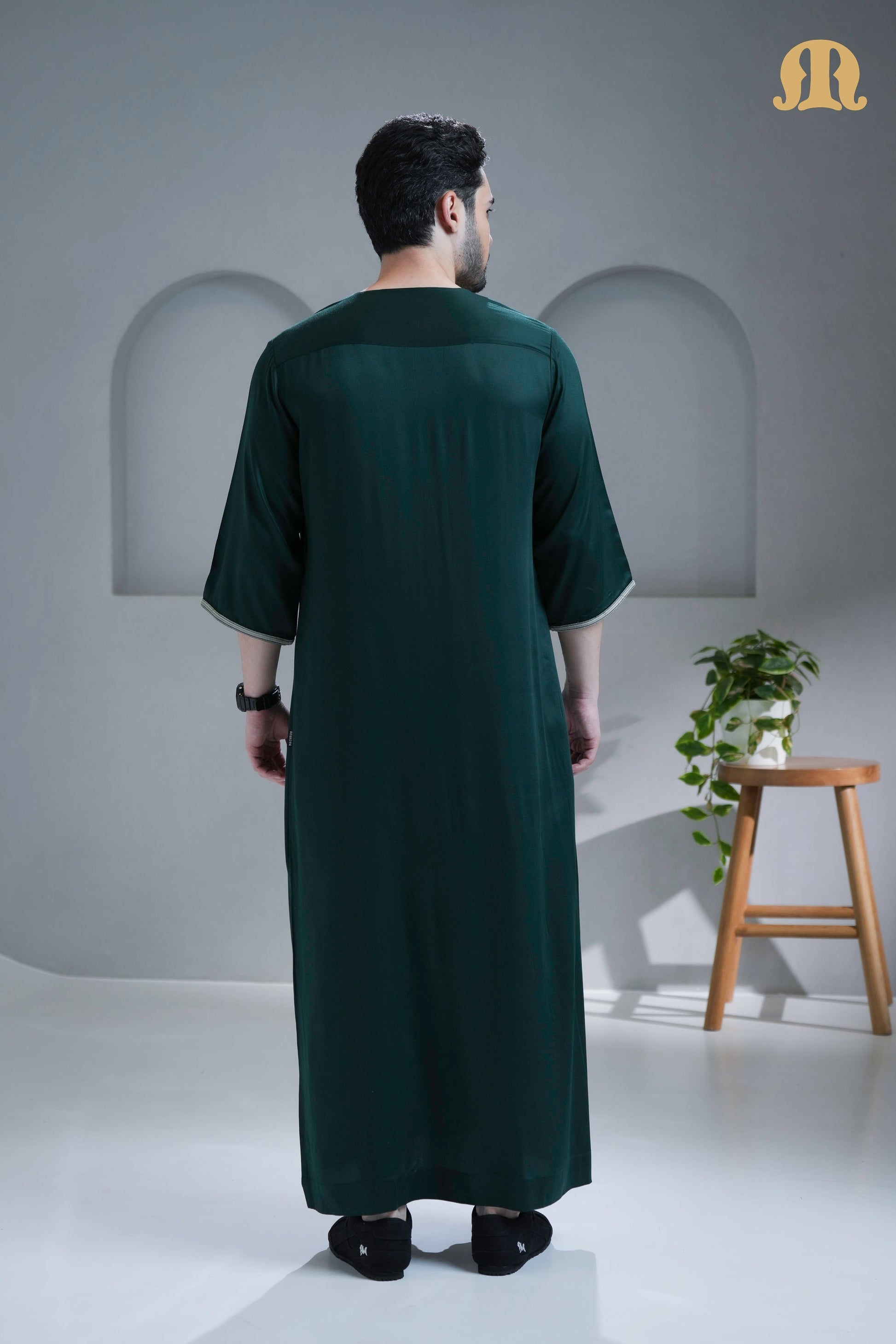 Side view of the Nasser Thobe showing the elegant drape of the viscose fabric.