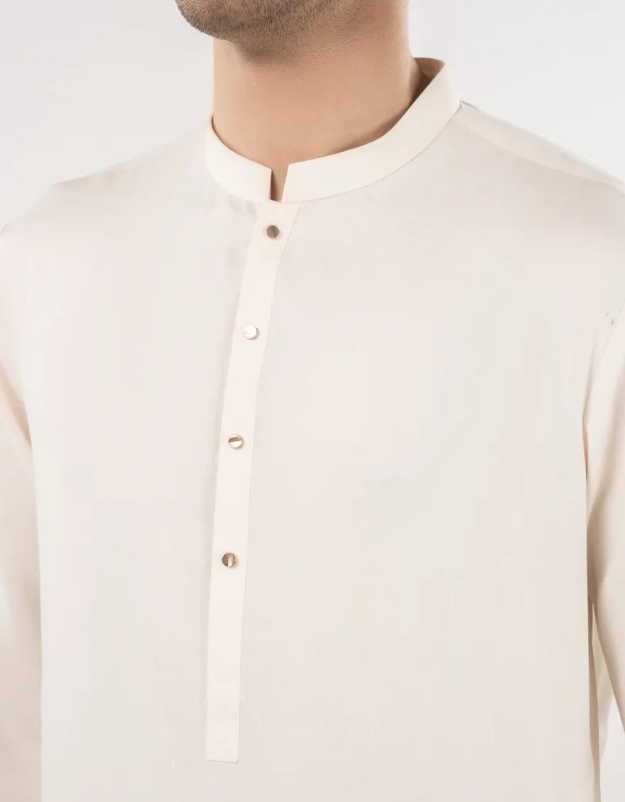 A close-up view showcasing the fine texture and weave of the Junaid Jamshed Fawn Blended Fabric.