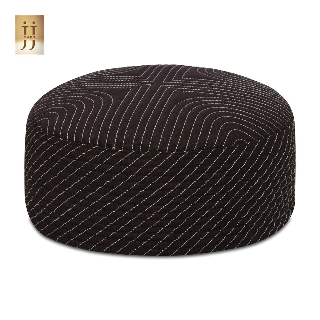 Close up of the intricate Sham and ZamZam patterns on this reversible JJ Topi.