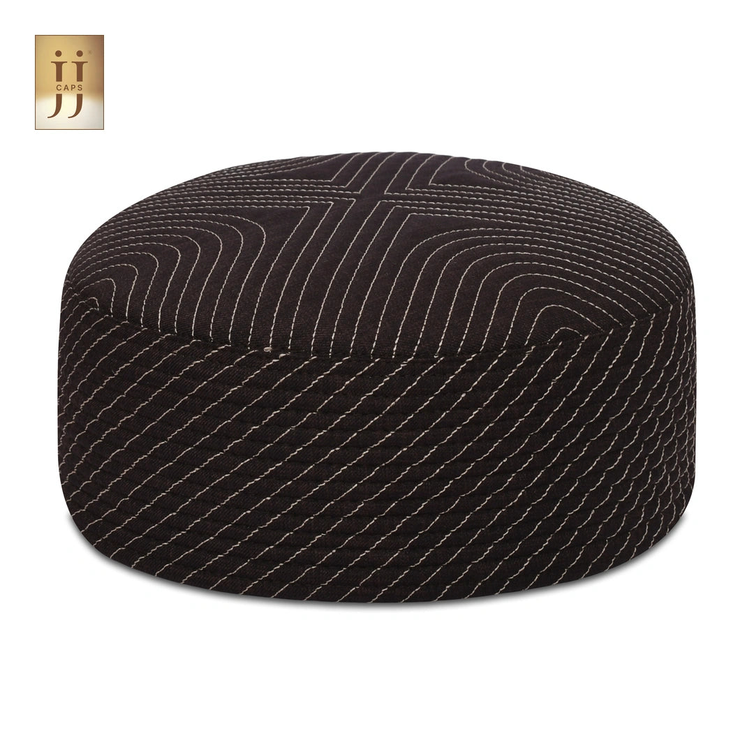 Close up of the intricate Sham and ZamZam patterns on this reversible JJ Topi.