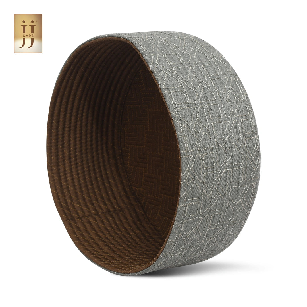 Close-up of the Riyad garden-inspired pattern on a Soft Sage HayaStyle reversible topi.