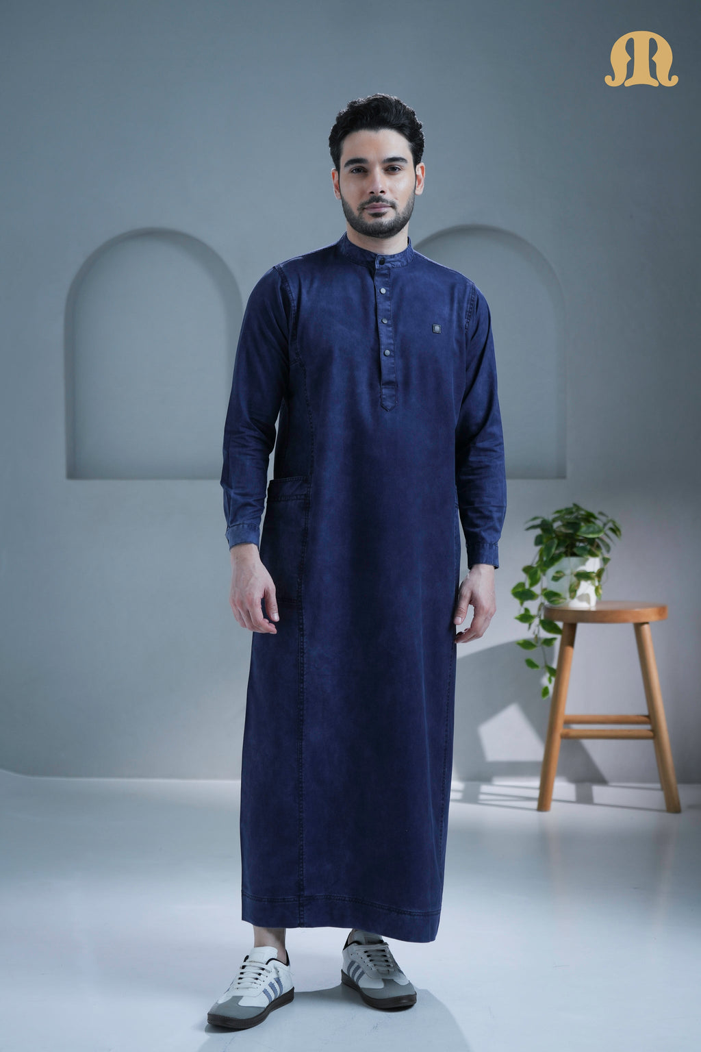 Back view of the long-sleeve Mekong Denim Thobe showcasing its fit.
