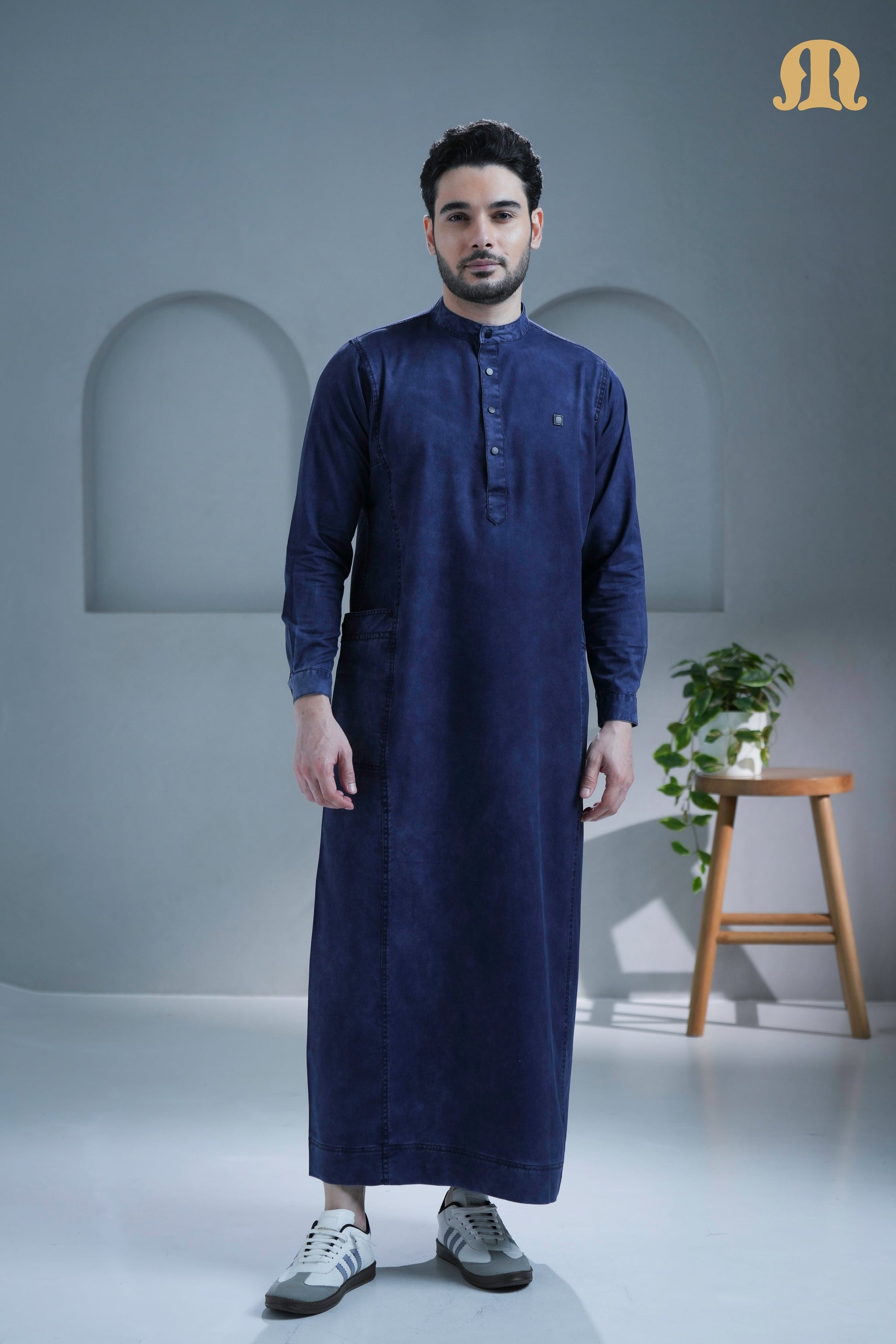 Back view of the long-sleeve Mekong Denim Thobe showcasing its fit.
