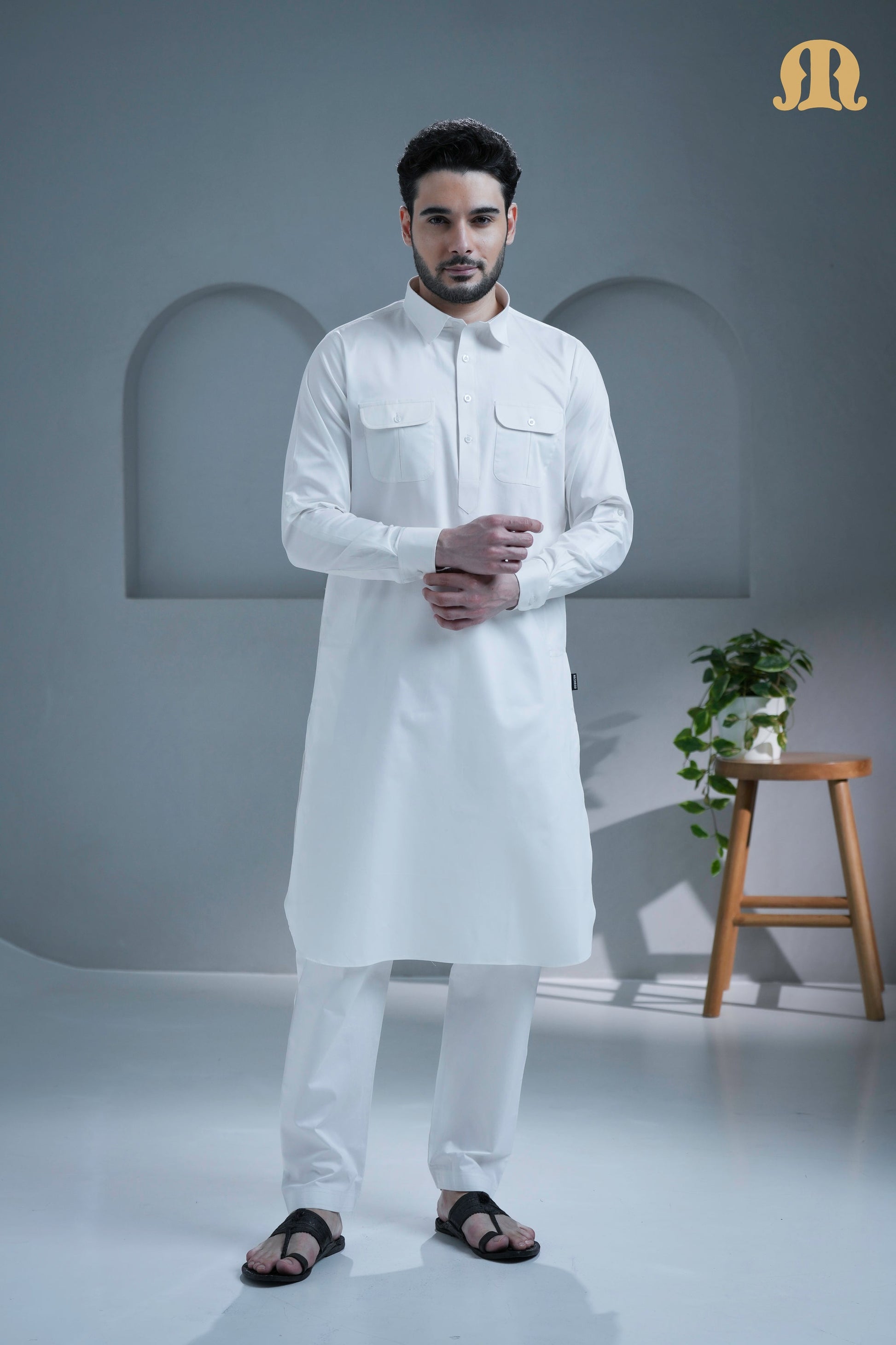 Front view of the complete Tunban Pathani Suit in pristine white by Mashroo.
