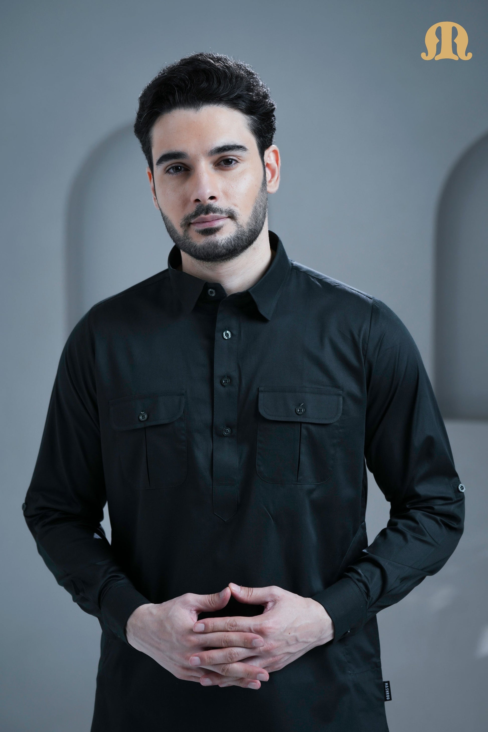 Man looking sophisticated in the dark grey Tunban Pathani suit from HayaStyle India.
