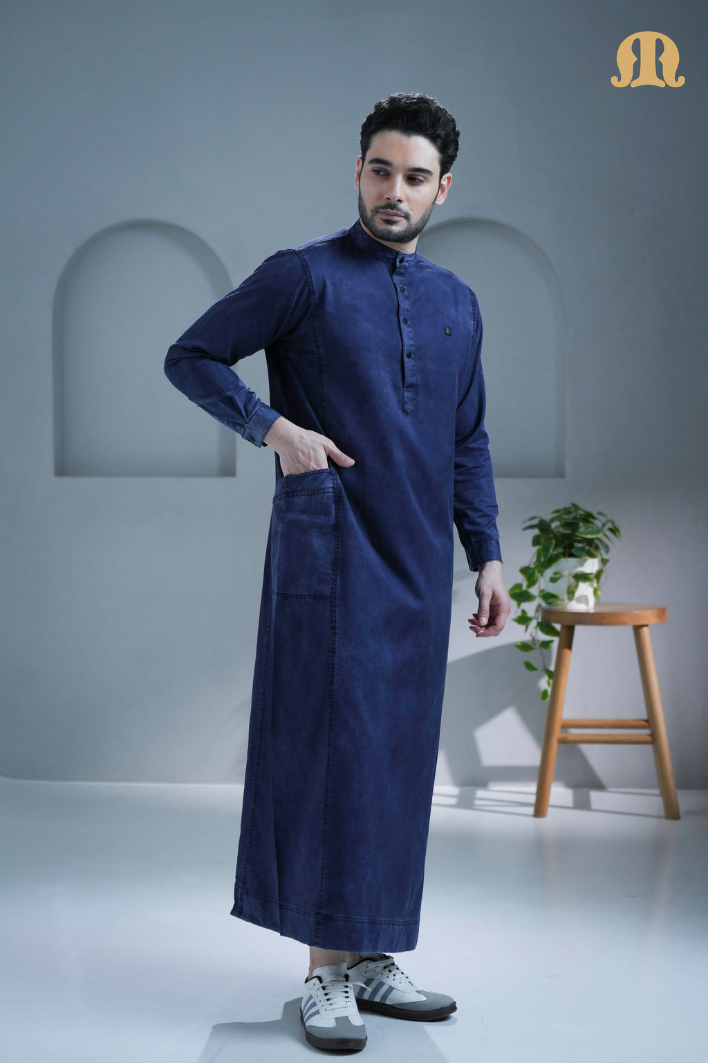 Close-up shot of the high-quality cotton denim fabric on the Mekong Thobe.
