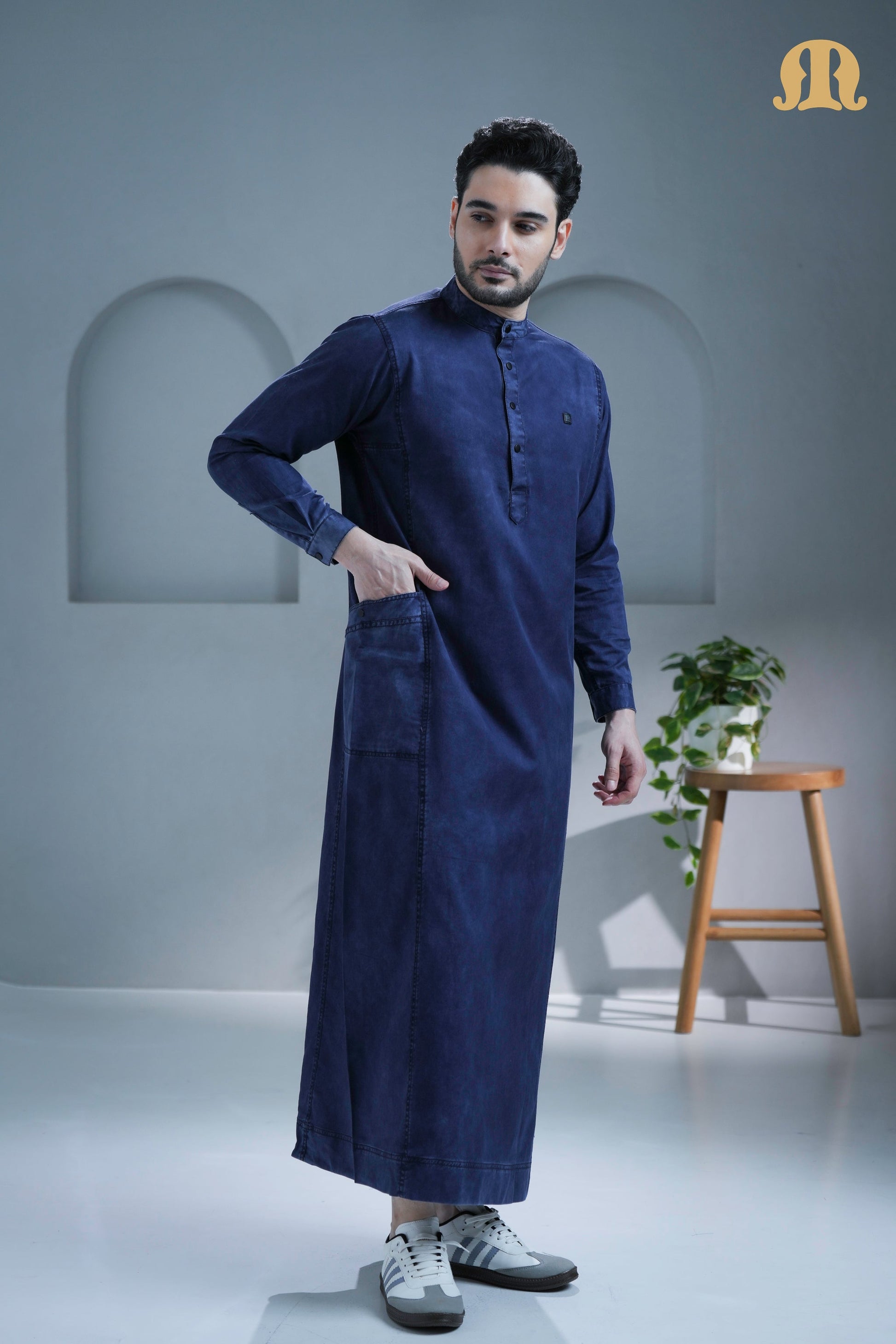 Close-up shot of the high-quality cotton denim fabric on the Mekong Thobe.
