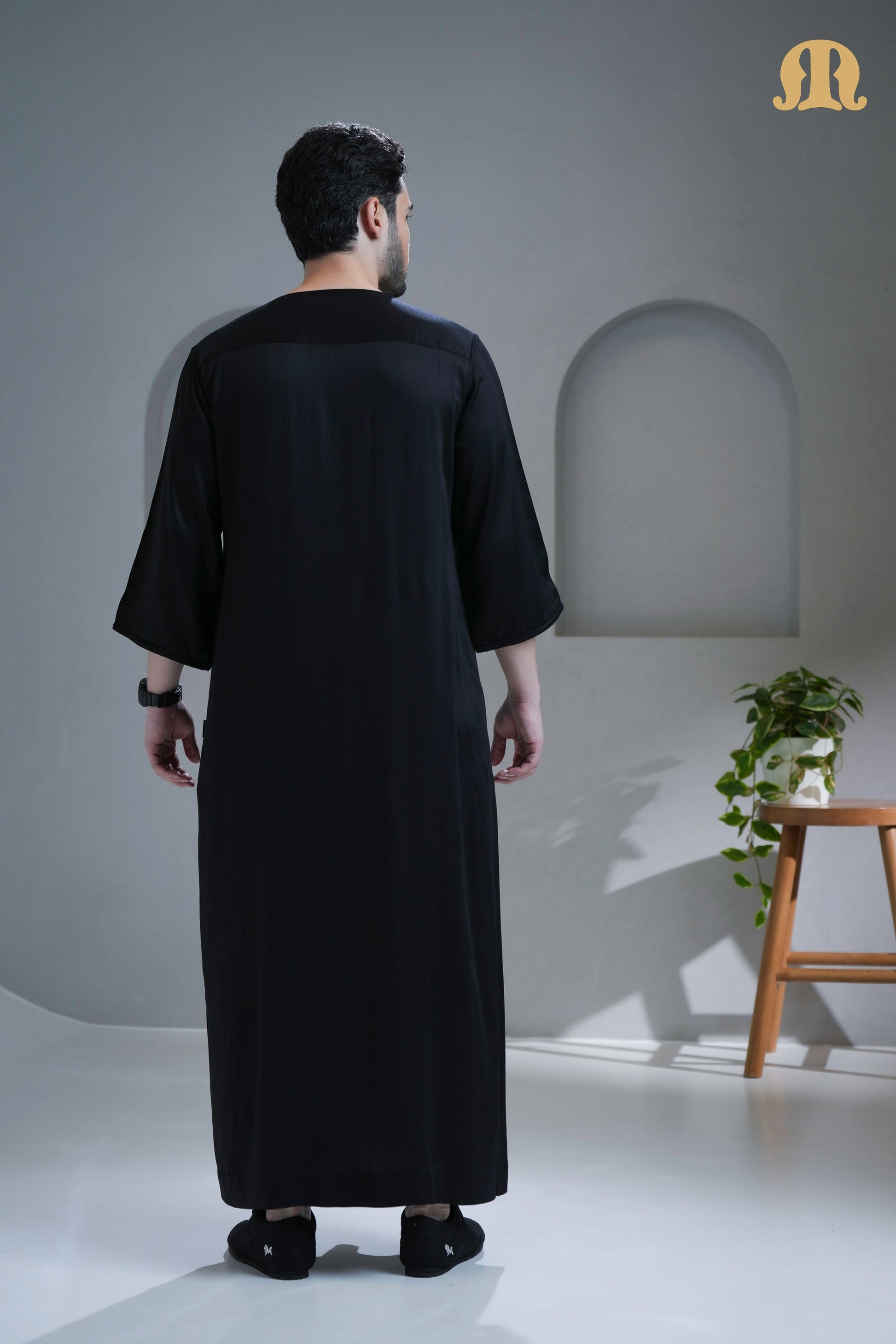 Front view of the Tiznit Black Moroccan Thobe for men by Mashroo.
