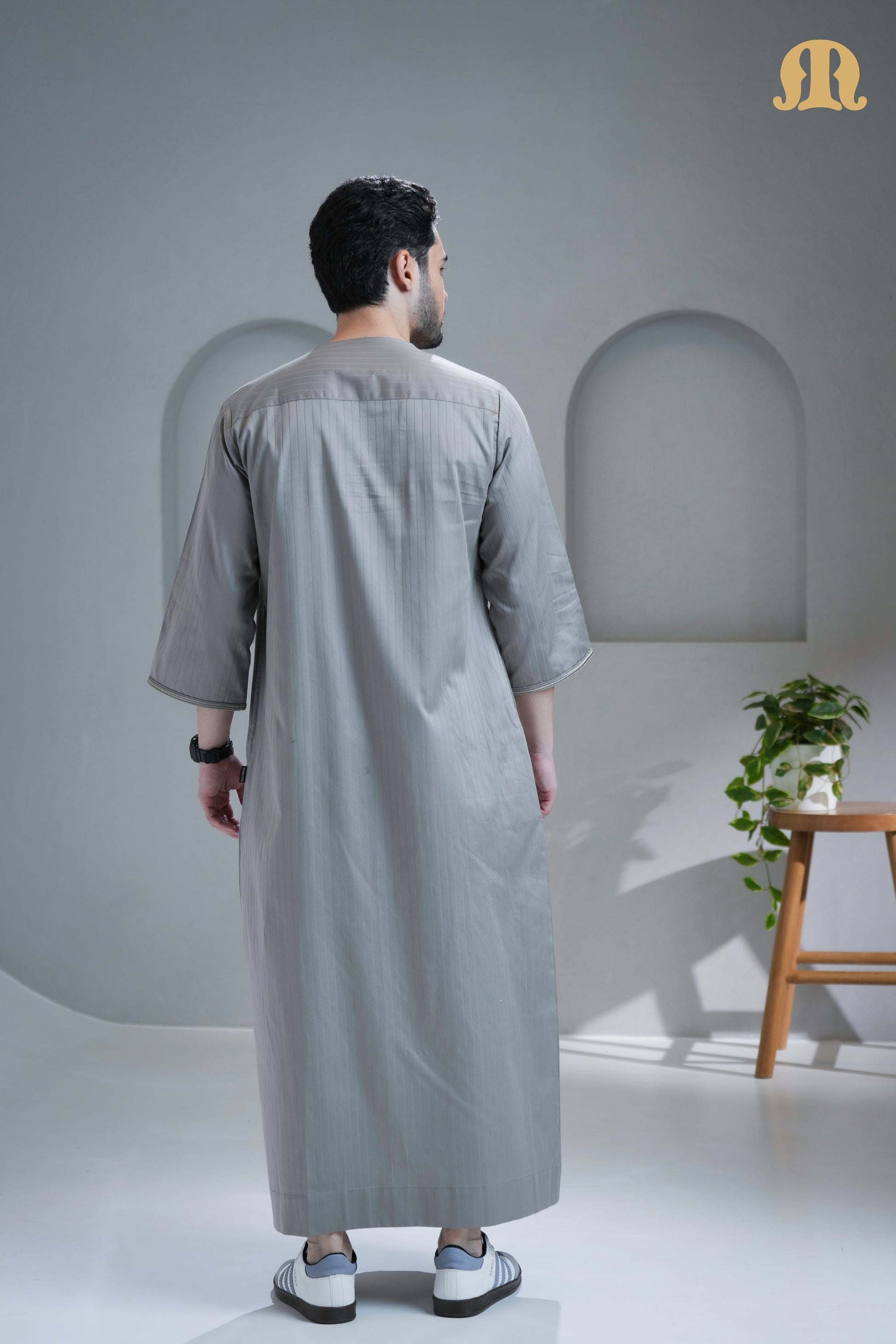Side profile of the men's Zagora Moroccan Thobe in durable poly-cotton fabric.
