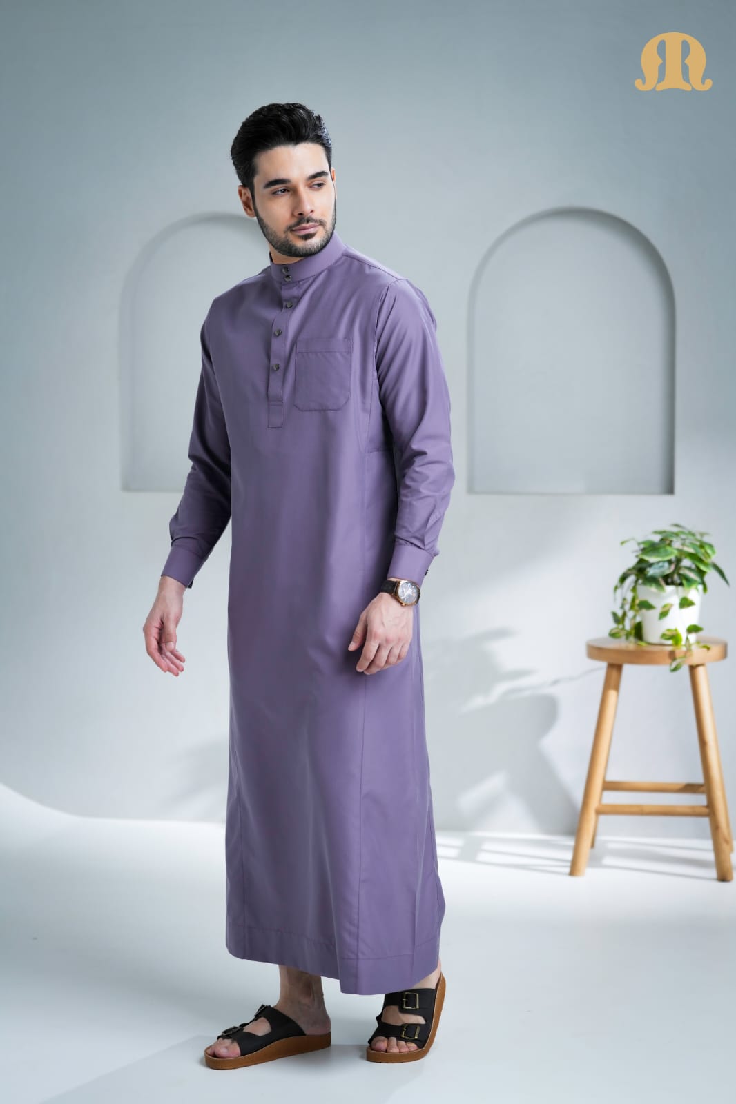 Close-up of the sleek metal snap buttons on the Mashroo Unicus Purple Thobe.
