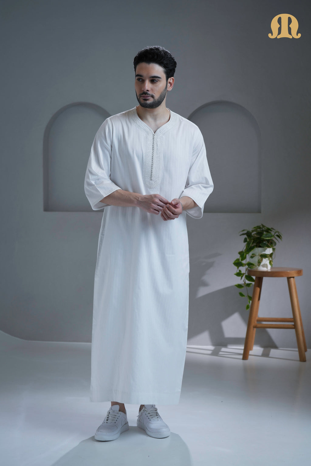 Detailed view of the traditional Moroccan neckline and embroidery on the Khatibi Thobe.
